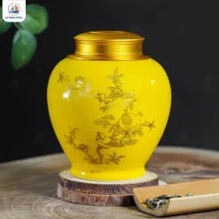 Hũ trà gốm men vàng họa tiết Lựu Khai Phú Quý