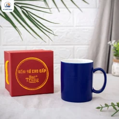 Cốc sứ men xanh quai C